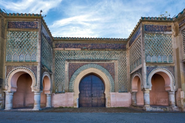 Marvel at the intricate details of Bab Mansour, the magnificent gate that stands at the entrance to the imperial city of Meknes in Morocco